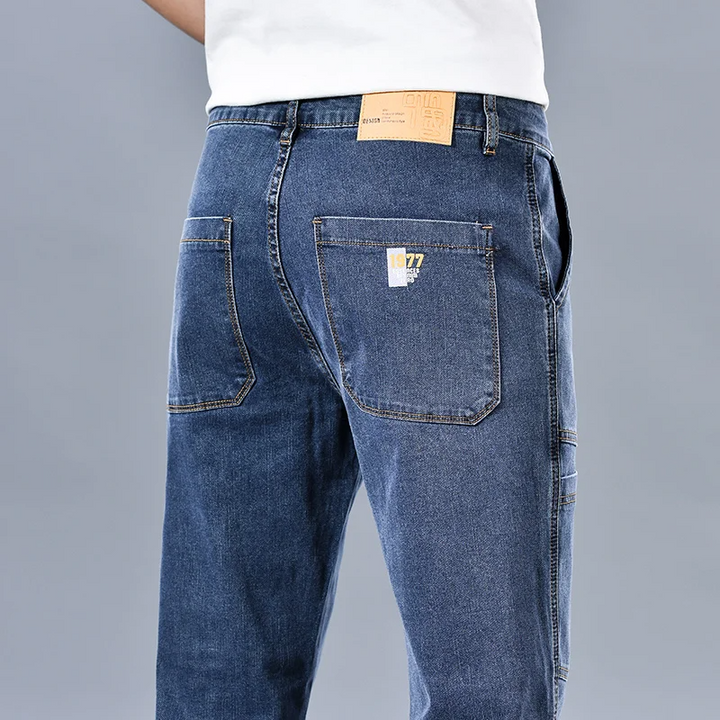Logan Denim Cargo Pants – Stretch Utility Jeans with Multi-Pocket Design & Tapered Fit